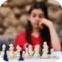 A picture of her playing chess